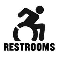 Graphic, Outline of a person in a mobility device moving forward in motion in black on a white background. Text, Capitalized and bolded RESTROOMS in black font on a white background. 